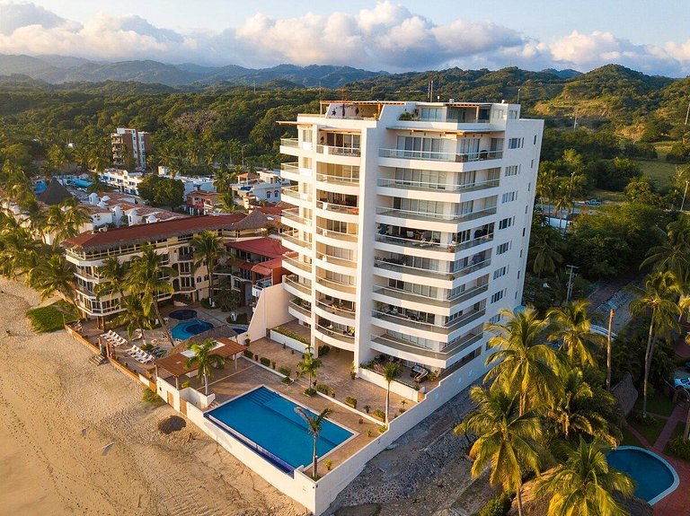 Beachfront Condo with Wrap-Around Terrace Views