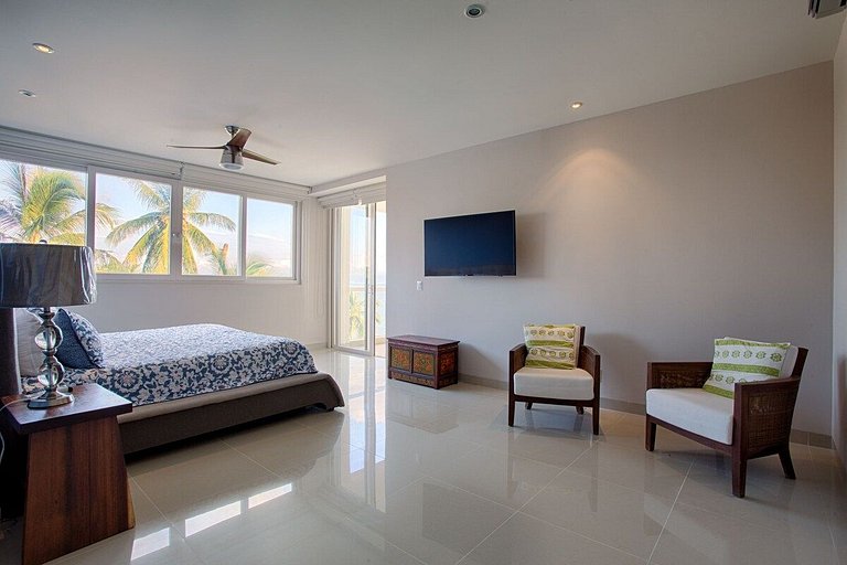 Beachfront Condo with Wrap-Around Terrace Views