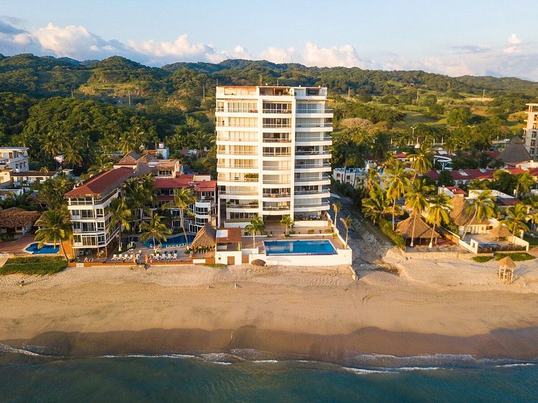 Beachfront Condo with Wrap-Around Terrace Views