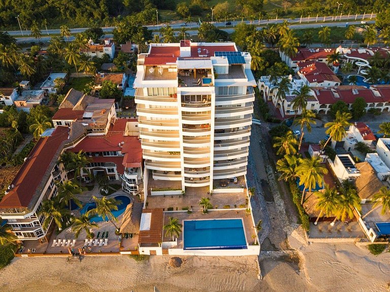 Beachfront Condo with Wrap-Around Terrace Views