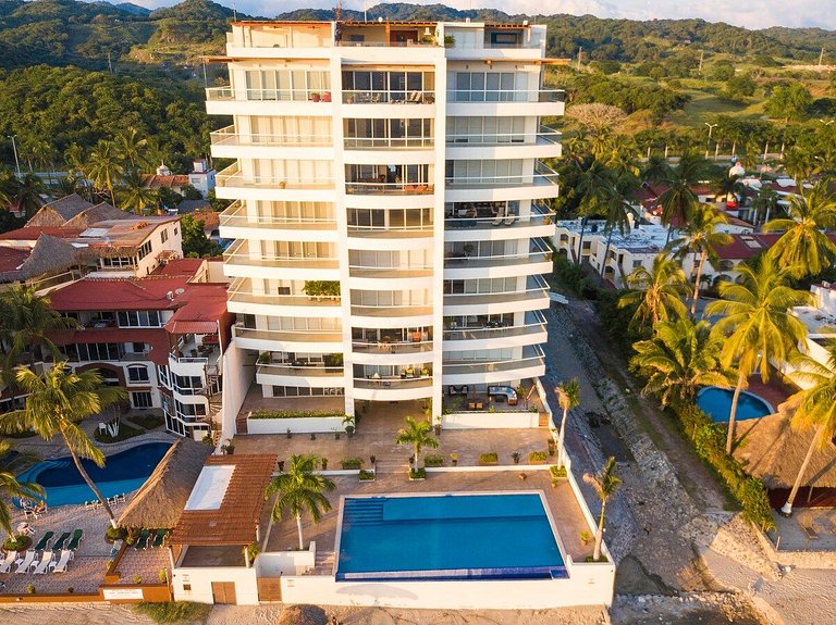Beachfront Condo with Wrap-Around Terrace Views