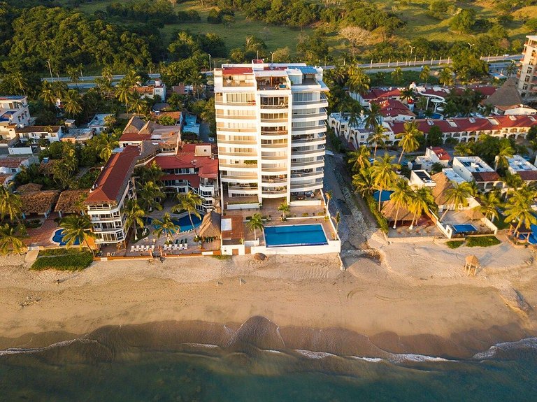 Beachfront Condo with Wrap-Around Terrace Views