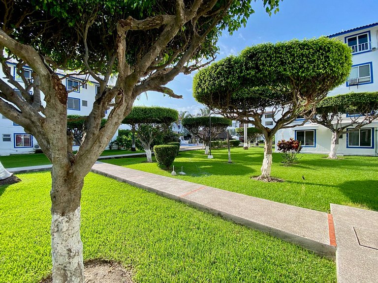 Palm-Shaded Pool Access, Near Beachfront Shops