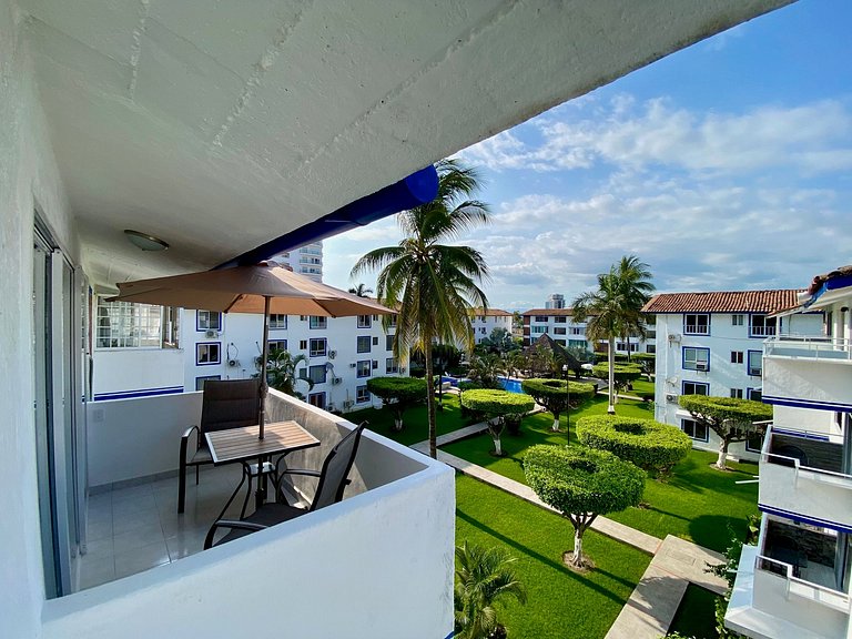 Palm-Shaded Pool Access, Near Beachfront Shops